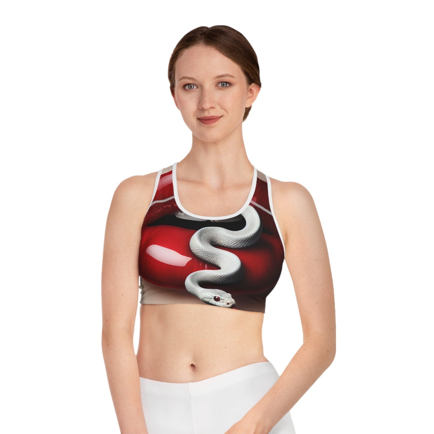 Woman wearing a sports bra with a snake design on a white background