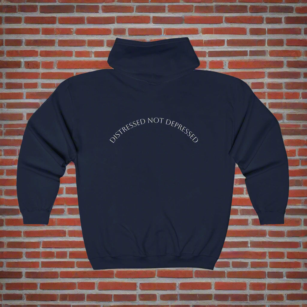 Navy blue hoodie with 'DISTRESSED NOT DEPRESSED' text on a brick wall background