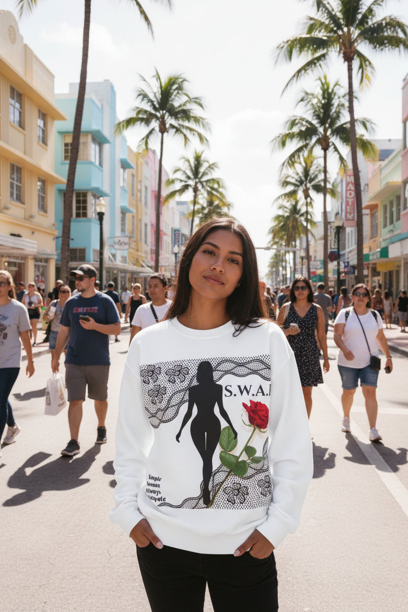 White sweatshirt with graphic design featuring a silhouette of a woman holding a red rose and text on a white background