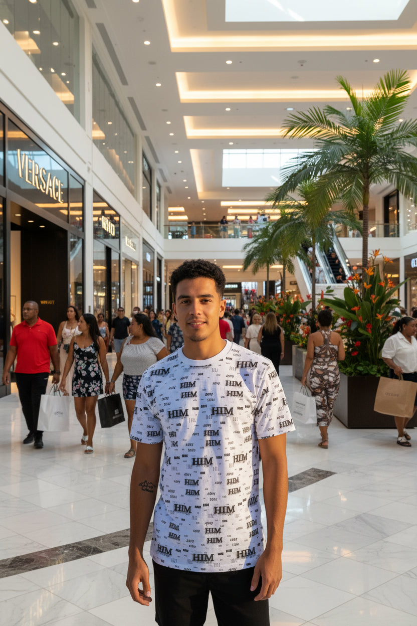 HIM All-Over Print Tee with bold graphic, durable polyester knit, ribbed collar, and tagless finish