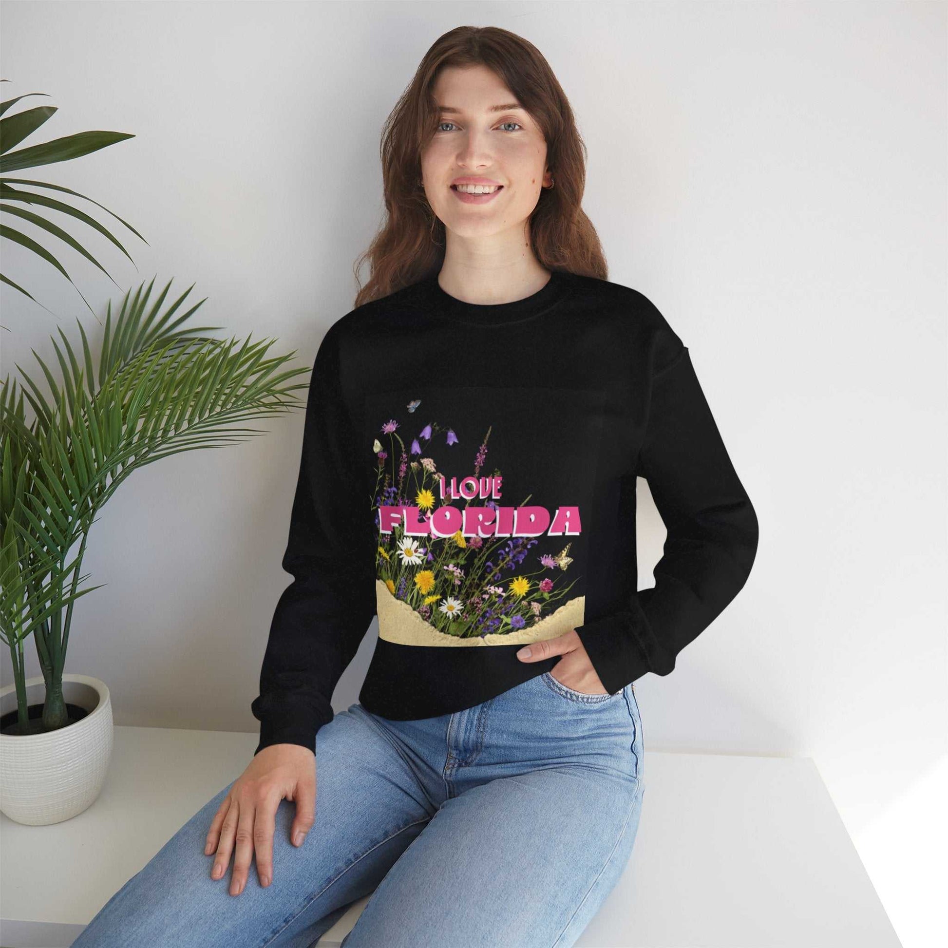 Black crewneck sweatshirt with pink "I Love Florida" lettering and floral design