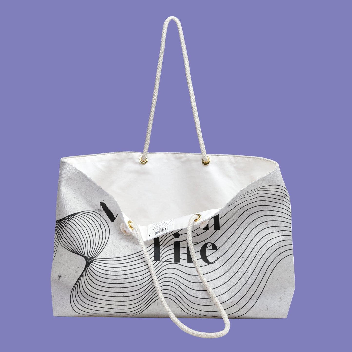 White tote bag with black abstract design and text on a white background