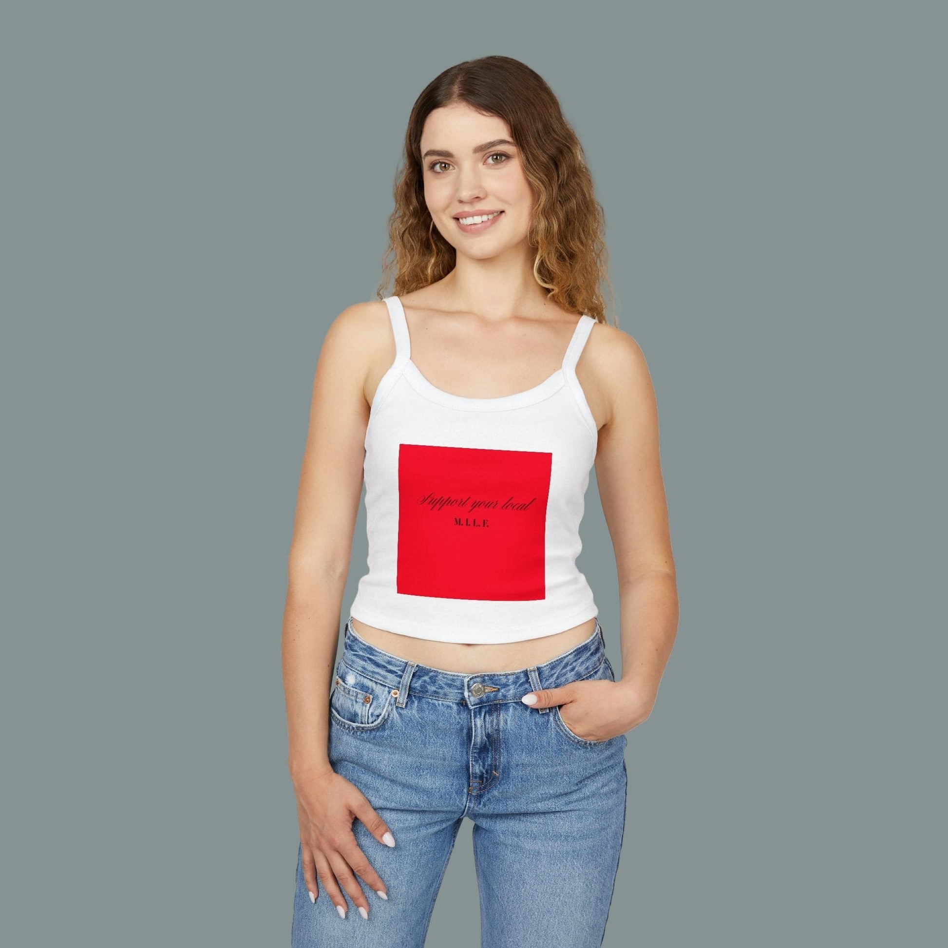 Woman wearing a white tank top with a red square design on a white background