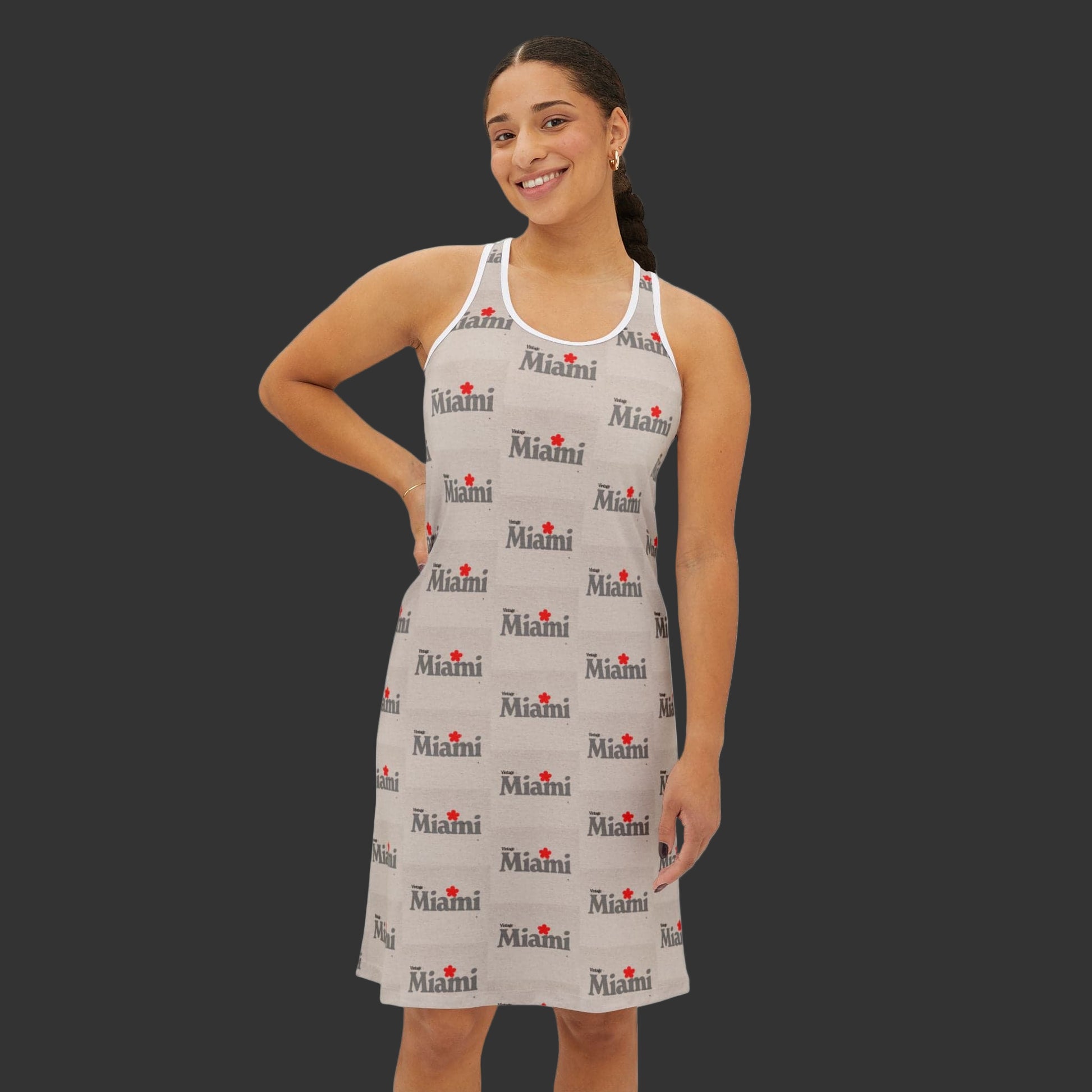 Woman wearing a sleeveless dress with 'Miami' print on a white background
