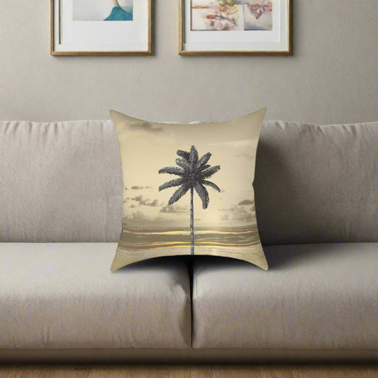 Decorative pillow with palm tree design on a beige background