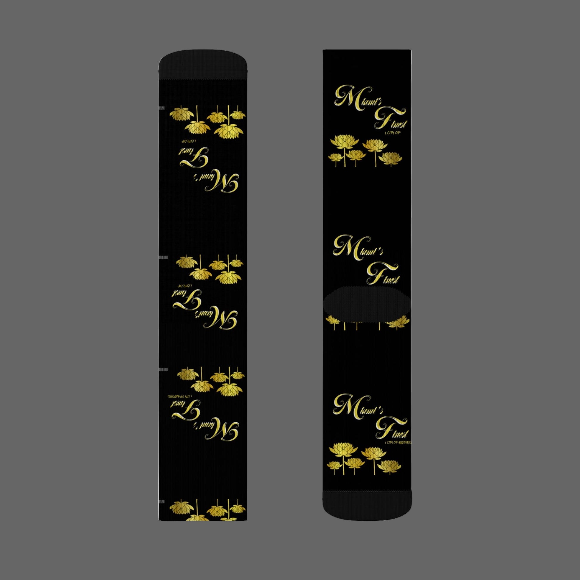 Two black sticks with gold floral designs and text on a white background