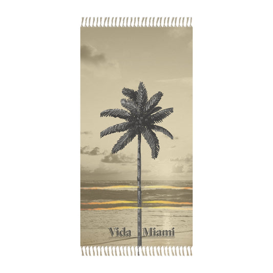Beige towel with palm tree design and 'Vida Miami' text on a white background
